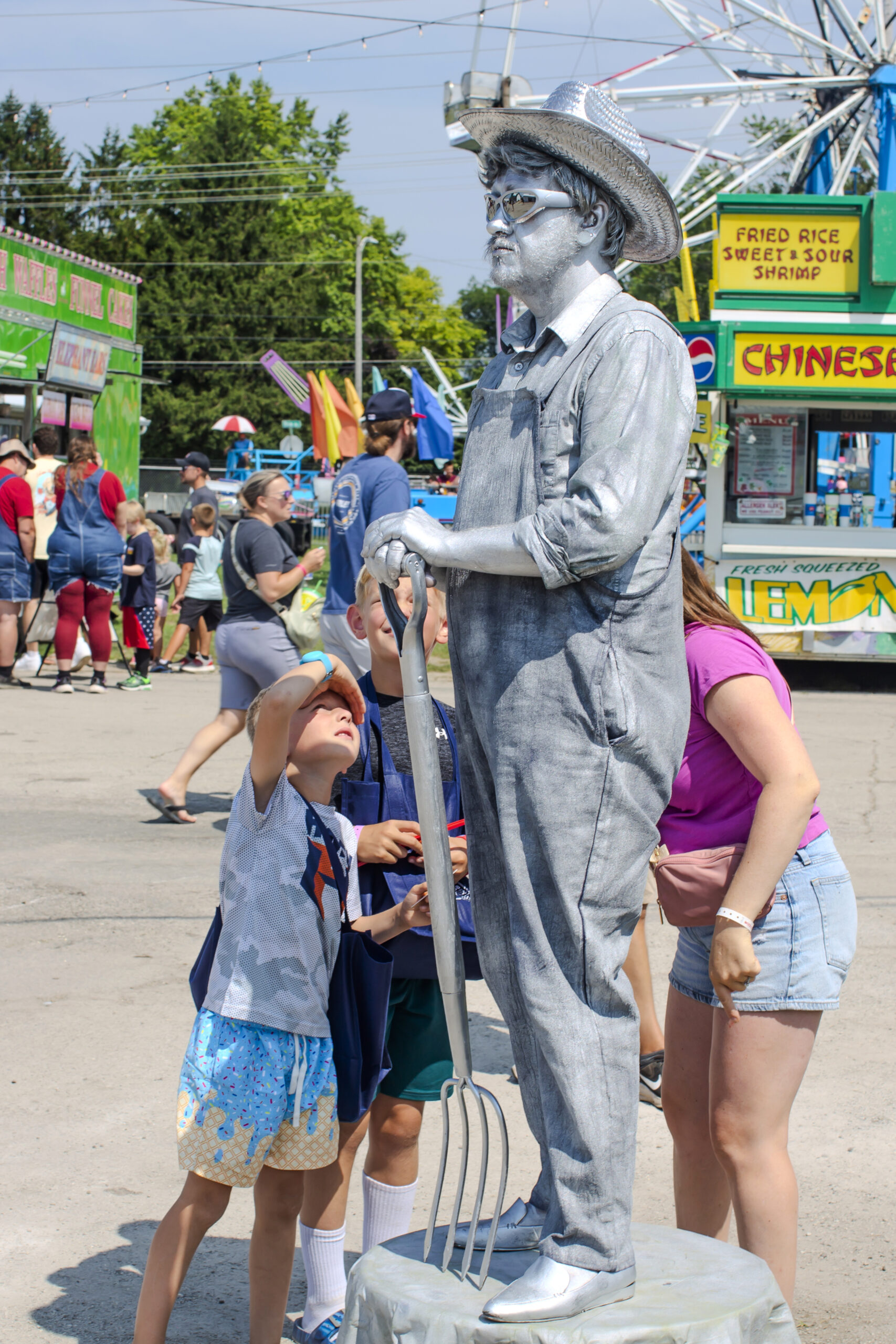 Silver living statue farmer with pitchfork