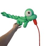 Green balloon creation resembling a whimsical creature.