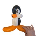 Cute balloon penguin with orange feet.