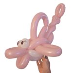 Pink balloon animal shaped like a flamingo.